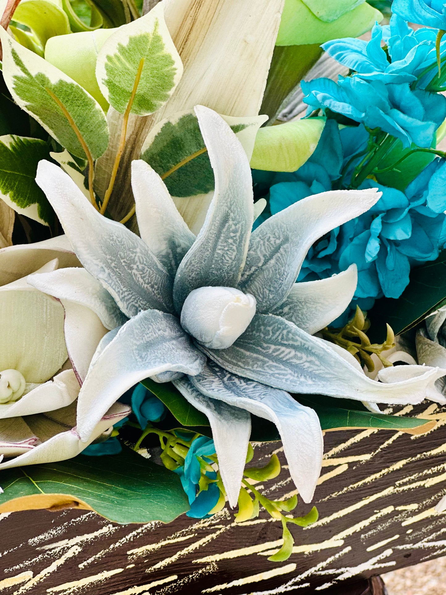 Floral Arrangement – Teal & Terracotta Centerpiece with Sculptural Green Foliage in Textured Planter