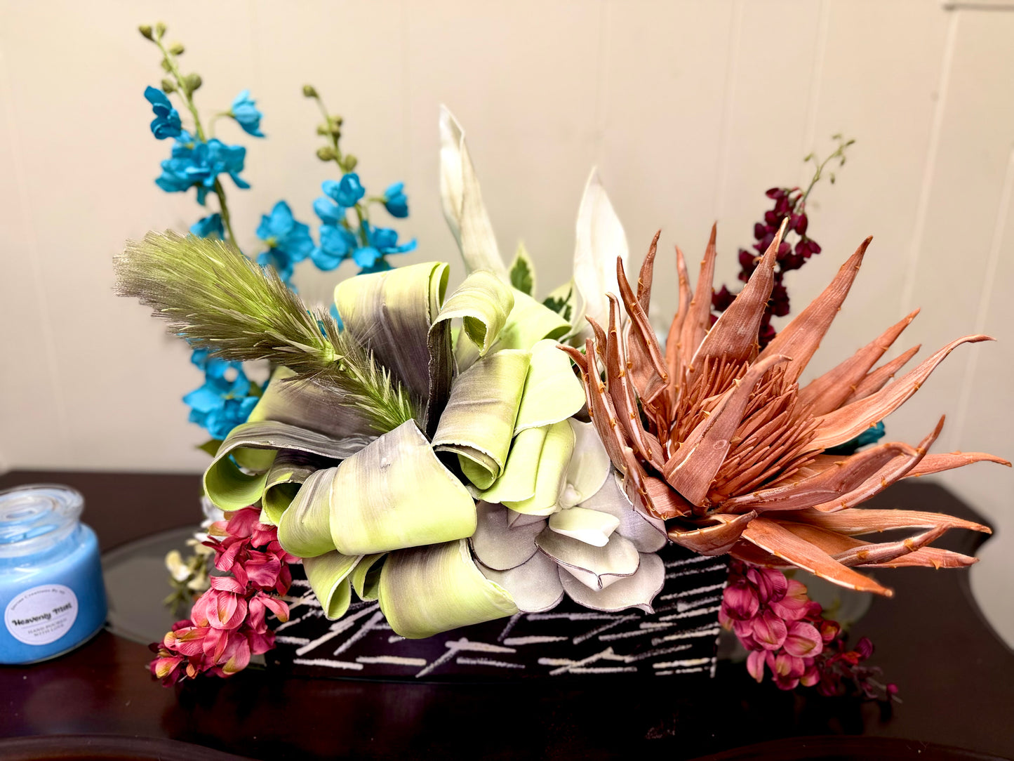Floral Arrangement – Teal & Terracotta Centerpiece with Sculptural Green Foliage in Textured Planter