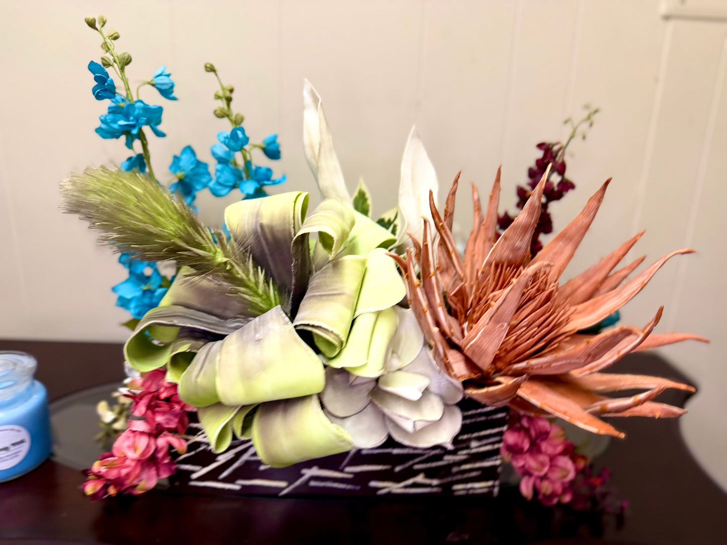 Floral Arrangement – Teal & Terracotta Centerpiece with Sculptural Green Foliage in Textured Planter