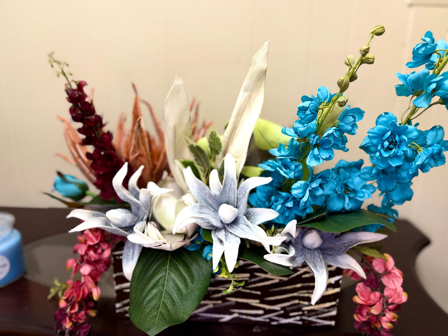 Floral Arrangement – Teal & Terracotta Centerpiece with Sculptural Green Foliage in Textured Planter
